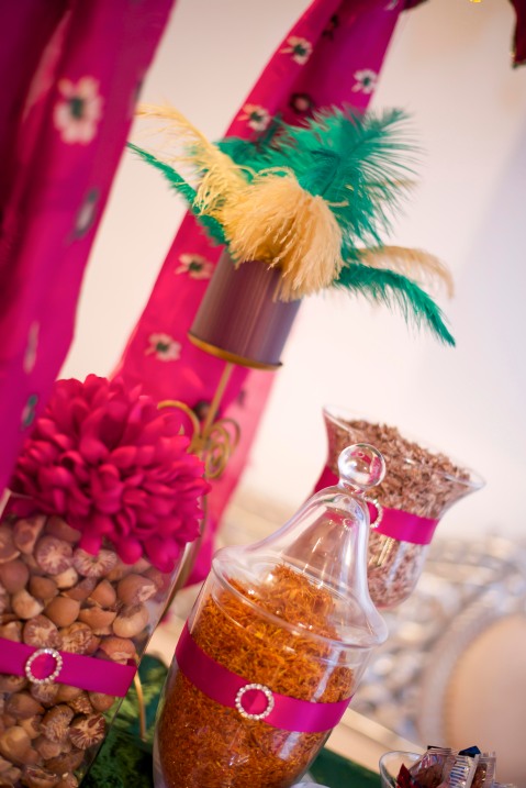 Purple and pink wedding decoration jars filled with exotic spices